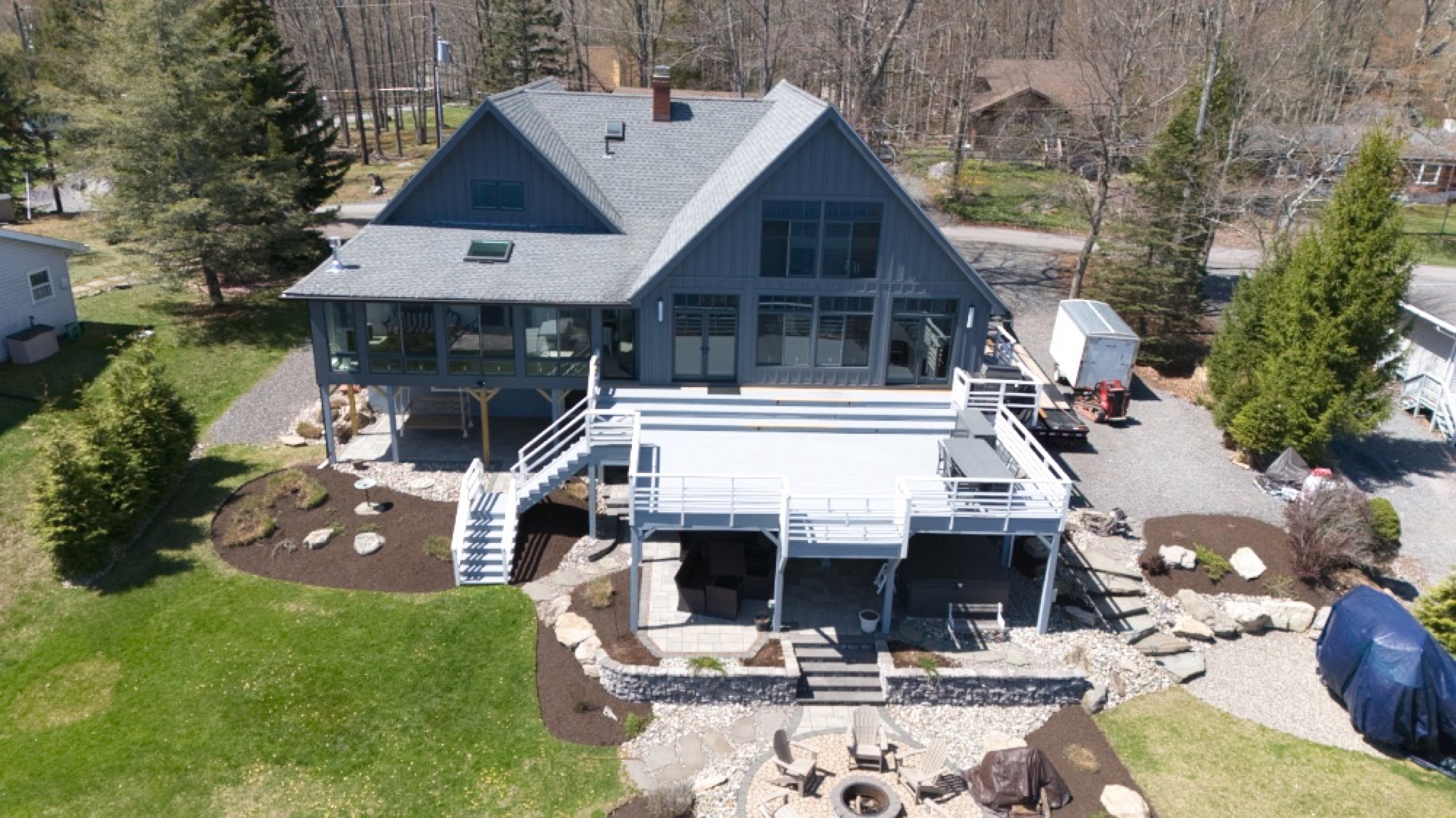 Aerial view of a renovated lakefront home by Wrona Construction
