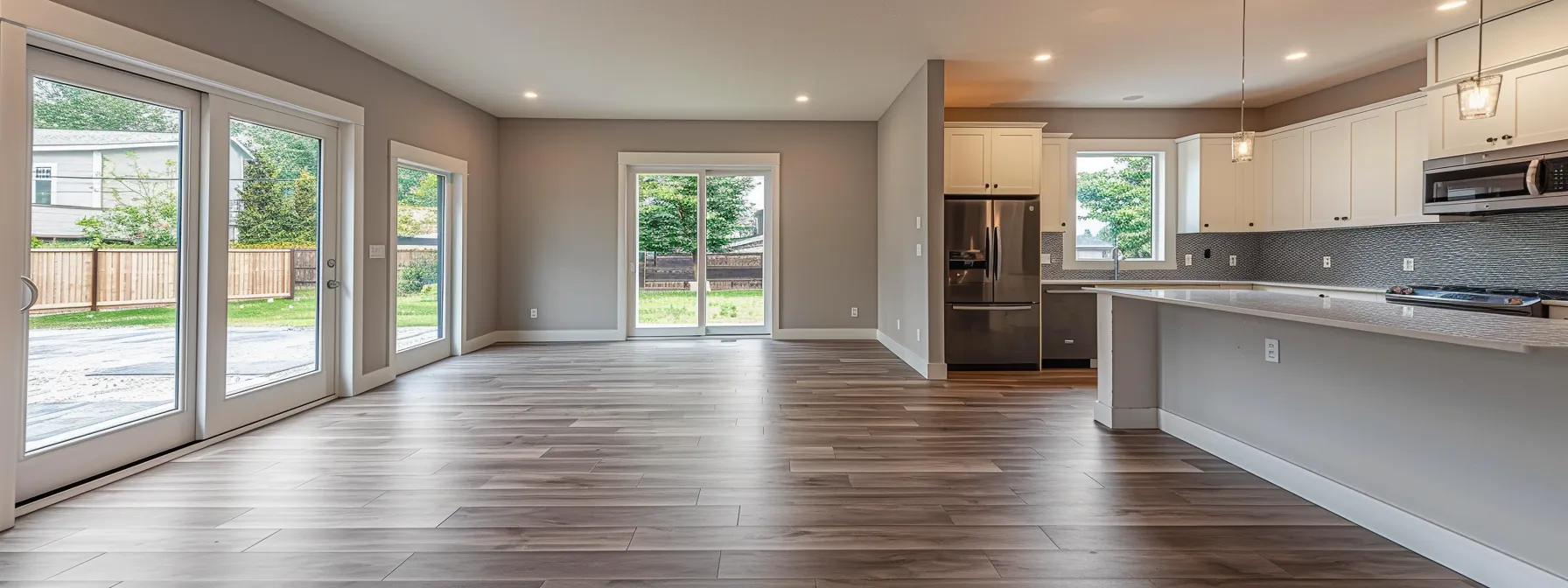 a modern kitchen with sleek hardwood floors and luxurious quartz countertops, showcasing the benefits of preserving the existing layout.